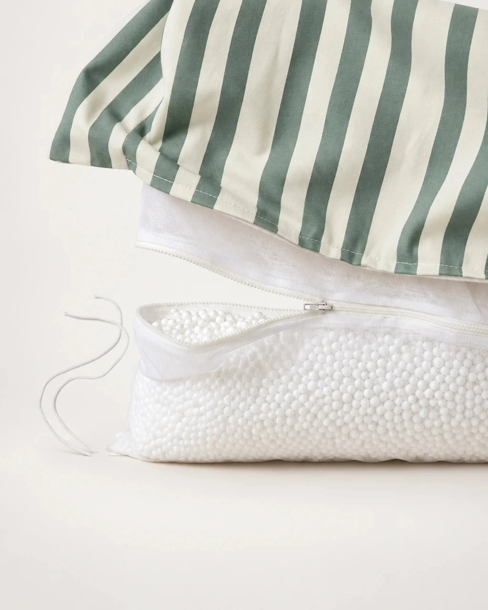 Striped outer cover lifted to show the separate inner bead bag