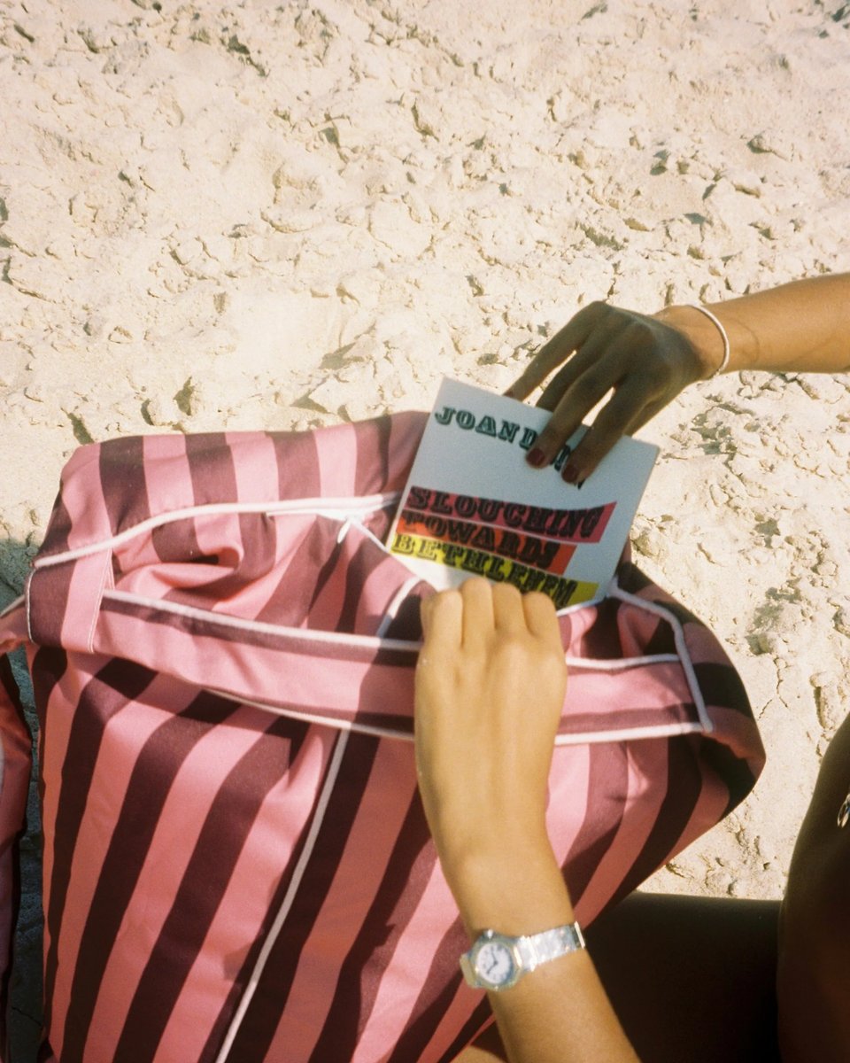 Taking a book out of the East Hampton backrest on the sand