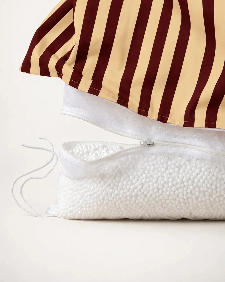 Striped outer cover lifted to show the separate inner bead bag