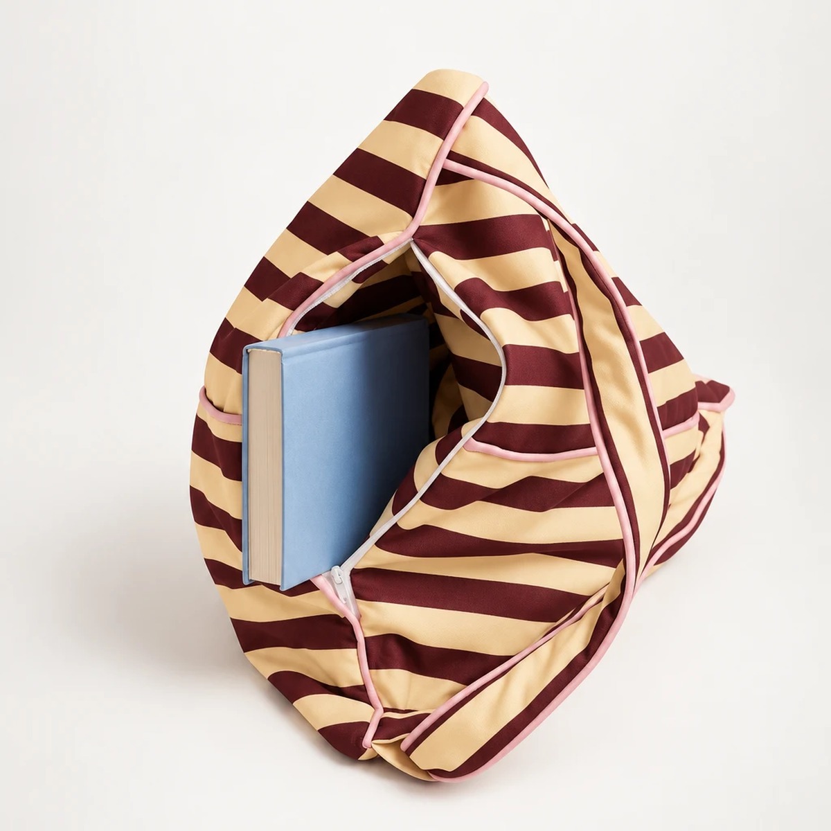 Open storage compartment with a hardcover book inside