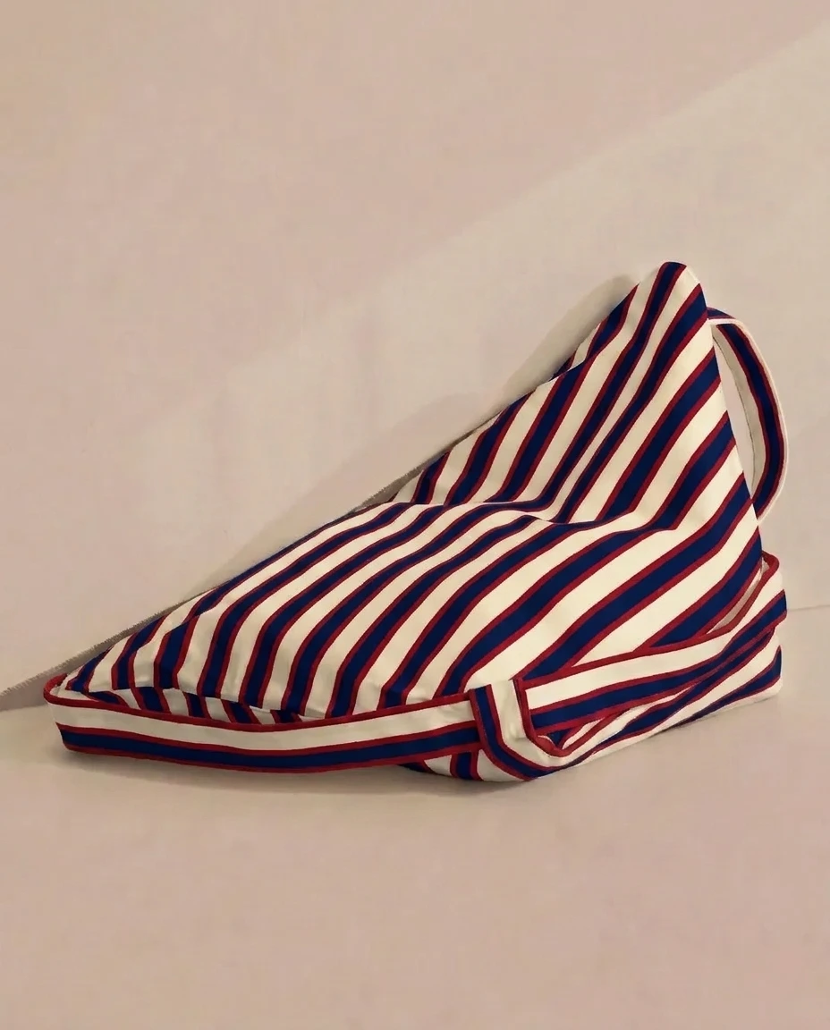 LIELOW Montauk — striped bag in chair form with red piping detail