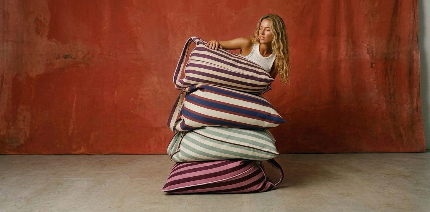 LIELOW — four colorways stacked, model behind a terracotta backdrop